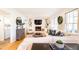 Bright living room with a fireplace, built-in bookshelves, and comfortable sofa at 3605 Wood Valley Ne Ct, Brookhaven, GA 30319