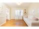 Cozy living room featuring hardwood floors, lots of natural light, and a guitar at 3605 Wood Valley Ne Ct, Brookhaven, GA 30319