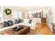 Comfortable living room with hardwood floors, plush seating, and access to the kitchen at 3605 Wood Valley Ne Ct, Brookhaven, GA 30319
