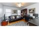 Cozy office with hardwood floors, ceiling fan, and ample shelving at 3605 Wood Valley Ne Ct, Brookhaven, GA 30319