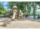 A colorful playground featuring slides and climbing structures, perfect for outdoor fun and recreation at 3605 Wood Valley Ne Ct, Brookhaven, GA 30319