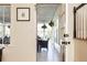 Hallway view of Sun Room featuring hanging plants, seating area and dining table at 3605 Wood Valley Ne Ct, Brookhaven, GA 30319