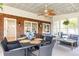 Bright sun room featuring brick accent wall, seating area and dining table at 3605 Wood Valley Ne Ct, Brookhaven, GA 30319