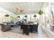 Spacious sun room featuring hanging plants, ceiling fan, and a cozy seating area at 3605 Wood Valley Ne Ct, Brookhaven, GA 30319