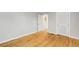 Empty bedroom with hardwood floors, closet and a door to another room at 966 Tilden Nw St, Atlanta, GA 30318