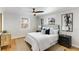 Cozy bedroom with a ceiling fan, neutral colors, area rug, and two windows at 966 Tilden Nw St, Atlanta, GA 30318
