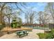 Community playground area with play structures, benches, picnic table, and a tennis court beyond the fence at 966 Tilden Nw St, Atlanta, GA 30318