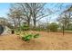 Outdoor playground with wood chip ground cover, swings, seesaw, and climbing structure at 966 Tilden Nw St, Atlanta, GA 30318