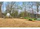 Community playground featuring a climbing structure, seesaw, and bench seating on wood chip ground cover at 966 Tilden Nw St, Atlanta, GA 30318
