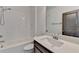 Modern bathroom with a white subway tile shower, modern vanity, and chrome fixtures at 1273 Harvest Park Ln, Suwanee, GA 30024