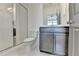 Bathroom features glass enclosed shower, vanity with storage, and modern fixtures at 1273 Harvest Park Ln, Suwanee, GA 30024
