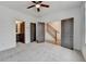 Bright bedroom features neutral carpet, ceiling fan, and convenient access to bathroom and stairway at 1273 Harvest Park Ln, Suwanee, GA 30024