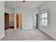 Spacious bedroom featuring soft carpet, multiple doorways, and a window offering neighborhood views at 1273 Harvest Park Ln, Suwanee, GA 30024