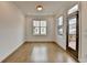 Bright dining room with hardwood floors, natural light, and access to the deck at 1273 Harvest Park Ln, Suwanee, GA 30024