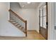Bright entryway featuring hardwood floors, staircase with black iron railings, and natural light at 1273 Harvest Park Ln, Suwanee, GA 30024