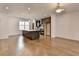 Gourmet kitchen boasts quartz island with pendant lighting and stainless steel appliances at 1273 Harvest Park Ln, Suwanee, GA 30024