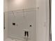 Utility area with a wire rack shelf above a washing machine hookup at 1273 Harvest Park Ln, Suwanee, GA 30024