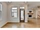 Transitional space between dining area and living room with hardwood flooring at 1273 Harvest Park Ln, Suwanee, GA 30024