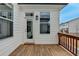 Cozy outdoor wooden patio area with privacy and natural light at 1273 Harvest Park Ln, Suwanee, GA 30024