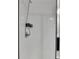 Shower features white subway tile, chrome fixtures, and convenient shower caddy at 1273 Harvest Park Ln, Suwanee, GA 30024