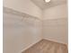 Spacious walk-in closet with carpeted floor and wire shelving for ample storage solutions at 1273 Harvest Park Ln, Suwanee, GA 30024