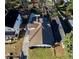 Aerial view of the property showcasing the home's roof, fenced backyard, long driveway, and shed at 1583 Elixir Sw Ave, Atlanta, GA 30314