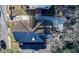 Aerial view showcasing the roof with mature tree nearby, driveway, and neighboring homes at 1583 Elixir Sw Ave, Atlanta, GA 30314