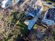 Aerial view of a home showing the backyard, long driveway, and fenced yard in a well-maintained outdoor space at 1583 Elixir Sw Ave, Atlanta, GA 30314