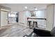 Basement with bar area, stools, and view into the kitchen at 1583 Elixir Sw Ave, Atlanta, GA 30314