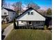 Lovely two-story home with a welcoming porch, complemented by manicured greenery and an adjacent driveway at 1583 Elixir Sw Ave, Atlanta, GA 30314