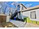 Charming home featuring an exterior staircase, shed, and freshly poured driveway for an elevated, stylish outdoor space at 1583 Elixir Sw Ave, Atlanta, GA 30314