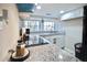 Modern kitchen featuring granite countertops and stainless steel appliances under recessed lighting at 1583 Elixir Sw Ave, Atlanta, GA 30314