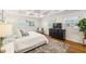 Serene bedroom with coffered ceiling, hardwood floors, and natural light from the many windows at 2173 Lebaron Ne Dr, Atlanta, GA 30345