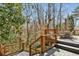 Upper level deck with outdoor seating and a heater overlooks a serene wooded area at 2173 Lebaron Ne Dr, Atlanta, GA 30345