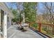 Spacious outdoor deck featuring a dining table and wooded views at 2173 Lebaron Ne Dr, Atlanta, GA 30345