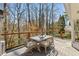 Outdoor deck with an umbrella table and wooded views at 2173 Lebaron Ne Dr, Atlanta, GA 30345