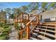 Multi-level deck with modern railings offers ample space for outdoor seating and entertaining at 2173 Lebaron Ne Dr, Atlanta, GA 30345