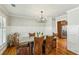 Elegant dining room features modern lighting, wainscoting, and hardwood floors at 2173 Lebaron Ne Dr, Atlanta, GA 30345