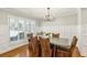 Bright dining room with wainscoting, natural light, and views into the living room at 2173 Lebaron Ne Dr, Atlanta, GA 30345