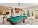 Game room with a well-maintained pool table and stylish lighting, perfect for entertainment at 2173 Lebaron Ne Dr, Atlanta, GA 30345