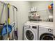 Well-organized laundry room with modern washer and dryer, ample storage, and functional countertop space at 2173 Lebaron Ne Dr, Atlanta, GA 30345