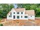 Beautiful white brick home exhibits contemporary architecture with a wood shingle roof and dark trim windows at 2983 Habersham Nw Ct, Atlanta, GA 30305