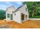 Three-car garage featuring white brick, and large garage door openings at 2983 Habersham Nw Ct, Atlanta, GA 30305