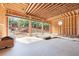 Bare studs of the garage with the garage door wide open showing earthwork in the backyard at 2983 Habersham Nw Ct, Atlanta, GA 30305