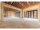 This spacious living room shows the bare studs, ceiling and flooring plus the large, black-trimmed sliding doors at 2983 Habersham Nw Ct, Atlanta, GA 30305