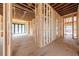 Spacious living area under construction with exposed wood framing, offering customizable design potential at 2983 Habersham Nw Ct, Atlanta, GA 30305