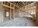 Bare stud framing of the living room, showing the staircase and the open-concept layout of the home's interior at 2983 Habersham Nw Ct, Atlanta, GA 30305