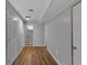 Finished basement hallway with vinyl floors and access to a utility room at 4373 Sun Valley Blvd, Atlanta, GA 30344