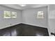Bedroom with dark wood floors, neutral paint, and multiple windows at 4373 Sun Valley Blvd, Atlanta, GA 30344