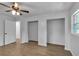 Bright bedroom featuring hardwood floors, ceiling fan and ample closet space at 4373 Sun Valley Blvd, Atlanta, GA 30344